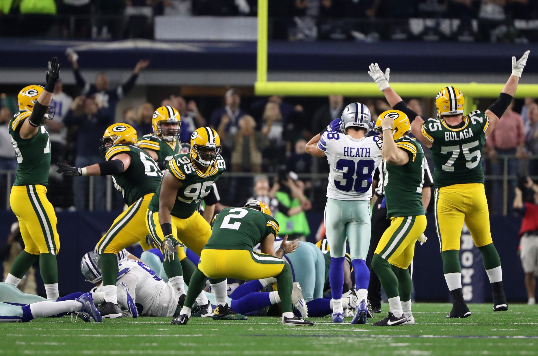 Green Bay Packers Aaron Rodgers looks to throw against the Dallas Cowboys  in the NFC divisional playoff game at AT&T Stadium in Arlington, Texas on  January 15, 2017. Rodgers went 28 of